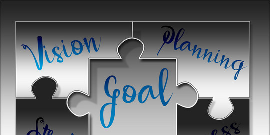 Puzzleteile mit den Worten Vision, Goal, Planning, Strategy und Process